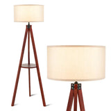 Tripod floor lamp with wooden legs and cream fabric shade, perfect for stylish decor