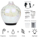 Designer glass aroma diffuser with textured surface and black base for aromatherapy