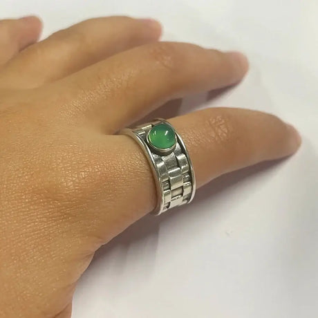 Silver ring featuring a natural jade stone centerpiece in vintage sterling style