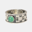 Silver geometric pattern ring featuring a round natural jade stone in sterling silver