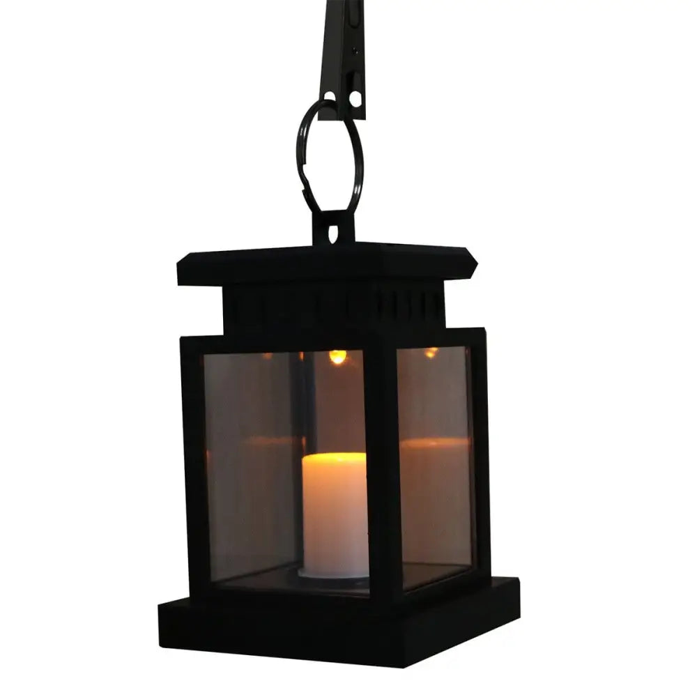 Black metal lantern with glowing waterproof LED solar candle light for outdoor use