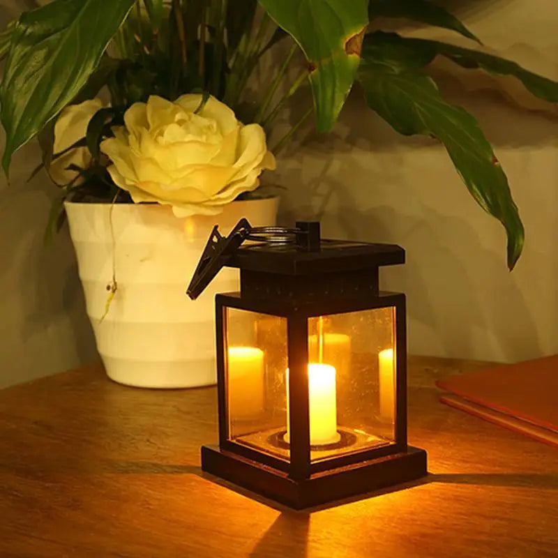 Black lantern with glowing LED candle inside Waterproof LED Solar Outdoor Garden Lamp