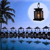 Waterproof LED Solar Outdoor Garden Lamp illuminating a serene pool with umbrellas at dusk