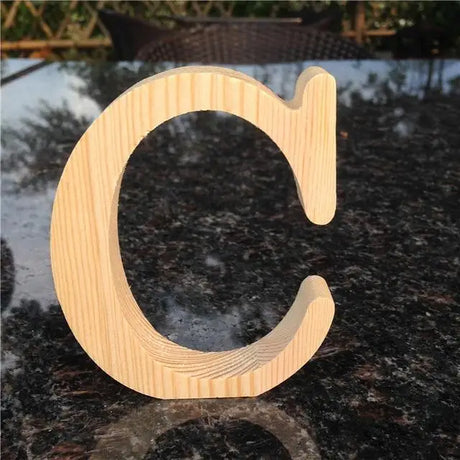 Wooden letter C with natural grain finish, perfect gift for home décor and photo frames