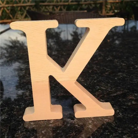 Wooden letter K in light beige, ideal for photo frames or as a perfect gift