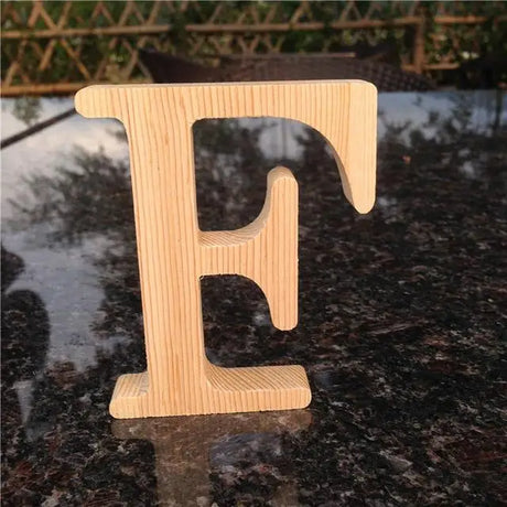 Wooden letter F in natural pine finish for photo frame and perfect gift decorations