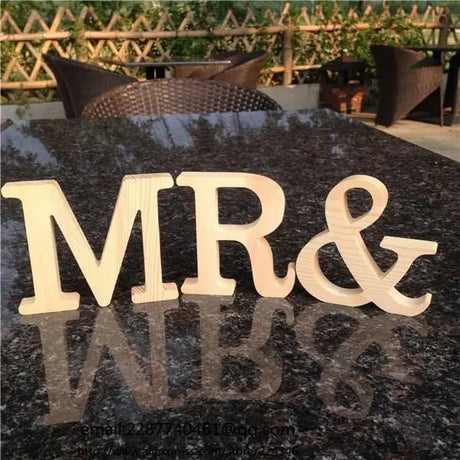 Wooden letters MR& casting reflection, ideal for photo frame or perfect gift decor