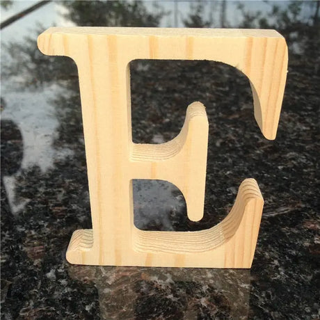 Wooden letter E in natural pine finish, ideal for photo frames or as a perfect gift