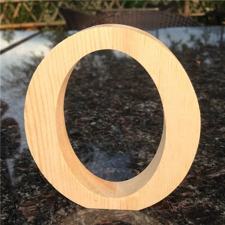 Wooden letter O in natural unfinished wood, ideal for home decor or as a perfect gift