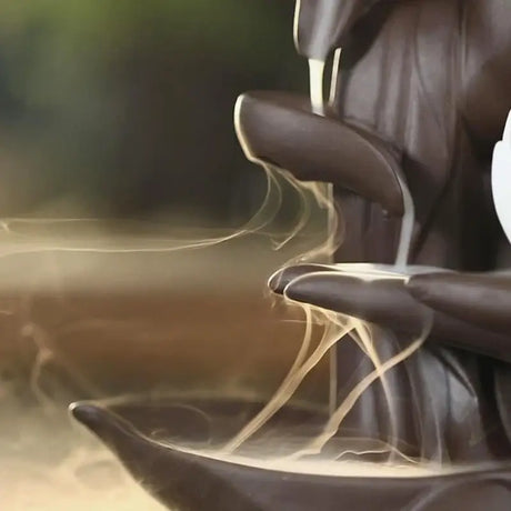 Chocolate fountain with steam cascading over Zen Incense Burner Buddha Hand Backflow